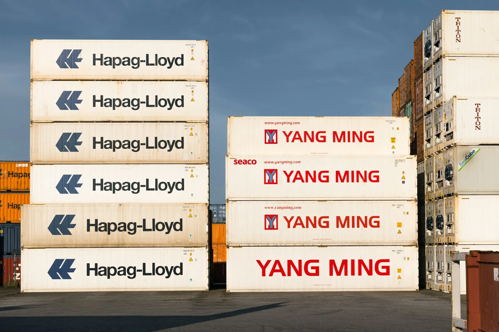 Shipping containers stacked in an open depot